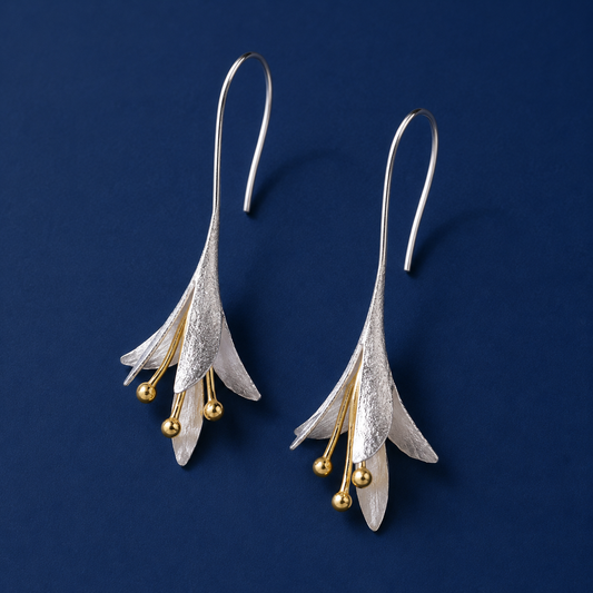 Elegant silver floral drop earrings with gold-tone accents for women
