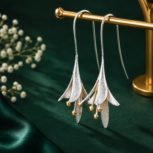 Elegant silver floral drop earrings with gold-tone accents for women