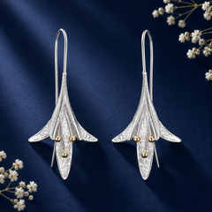 Elegant silver floral drop earrings with gold-tone accents for women