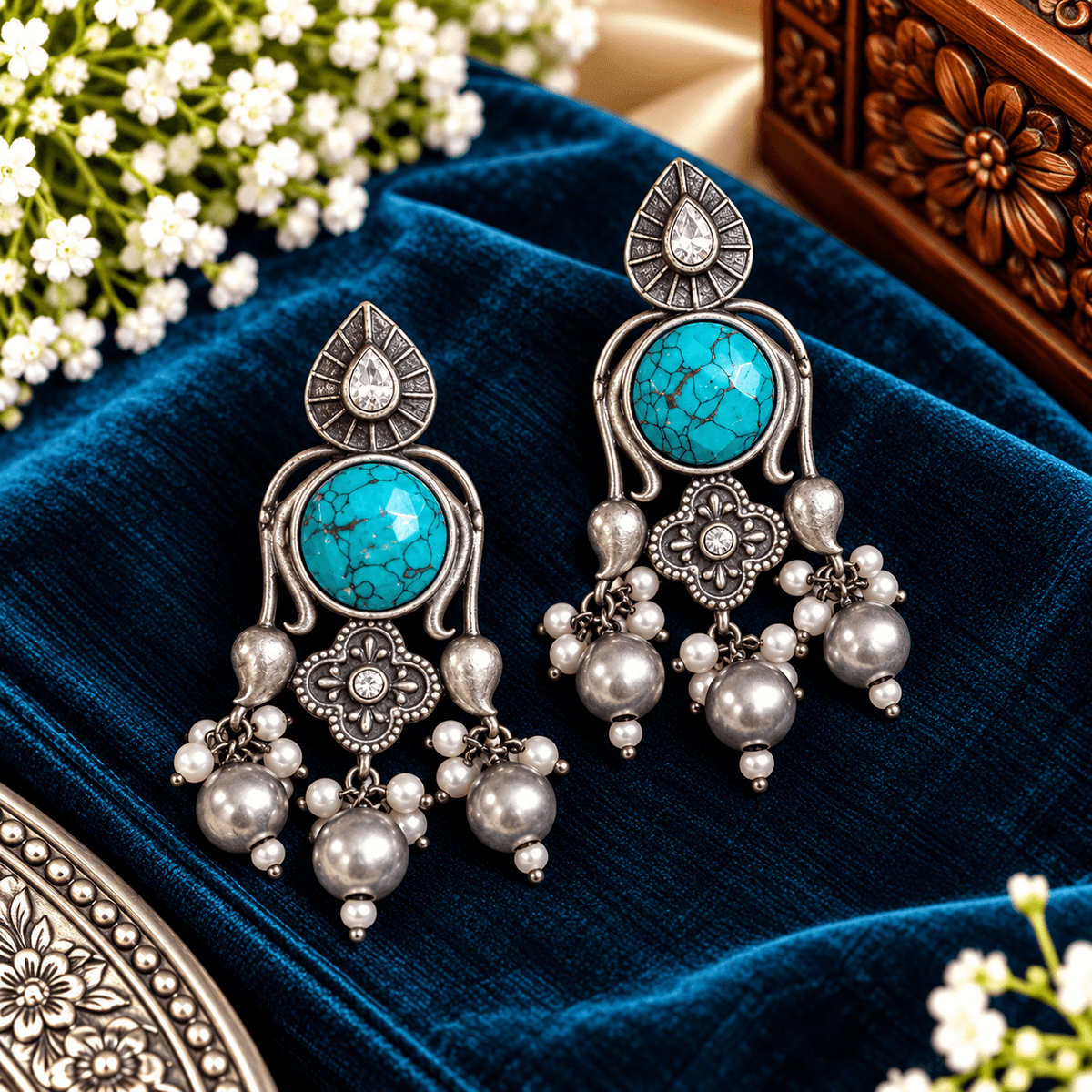 Turquoise stone oxidized silver chandelier earrings with floral detailing and multiple pearl-style dangling beads