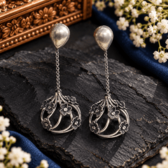 Antique silver-tone floral drop earrings with chain links and an openwork flower frame